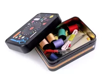 Sewing toolbox in a large metal can