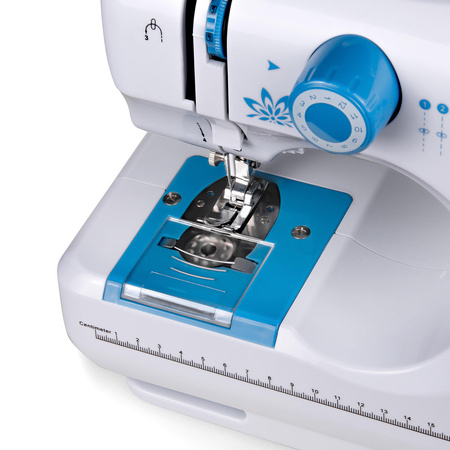 Lucznik Mini Blue sewing machine with a set of feet